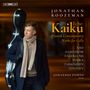 Text: "Jonathan Roozeman - Echo Kaiku - Finnish Contemporary Works for Cello." Ein Mann mit Cellokoffer, warm gekleidet., Super Audio CD