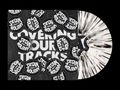 „Satan Takes a Holiday“ mehrfach auf runden Stickern über „Covering Our Tracks“. Schallplatte mit schwarz-weißen Mustern., LP
