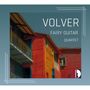 "VOLVER", "FAIRY GUITAR", "QUARTET". Bunte Gebäude mit blauen, roten und gelben Fassaden, blauer Himmel., CD