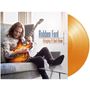 Text: "Robben Ford - Bringing It Back Home". Ein Mann sitzt auf einem Sofa mit einer Gitarre in der Hand. Goldene Vinylplatte., LP