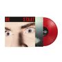 Text: "DE STAAT" in roten Großbuchstaben. Nahaufnahme von blauen Augen, daneben eine rote Vinyl-Schallplatte., LP