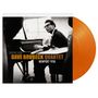 "Original Album Dave Brubeck Quartet Newport 1958". Schwarz-weißes Foto eines Mannes am Klavier, oranger Vinyl-Schallplatte., LP