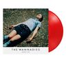 "The Wannadies, Bagsy Me." Eine Person in blauer Bluse und Rock liegt auf herbstlichem Boden. Rote Vinyl-Schallplatte., LP