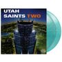 Text: "UTAH SAINTS TWO". Darstellung: Nachtansicht eines beleuchteten Wolkenkratzers mit Blick auf eine Stadt., 2 LPs