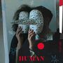 Texte: „HUMAN“, „SAFARI“. Zwei Personen halten maskenartige Objekte mit Spitzen und Löchern. Blaue Sterne als Dekoration., LP