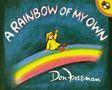 "A RAINBOW OF MY OWN" steht in großer Schrift. Ein Kind in Regenkleidung sitzt auf einem Regenbogen.