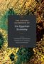 Text: "The Oxford Handbook of the Egyptian Economy." Farbenfrohes abstraktes Muster in Grün und Gelb., Buch