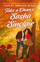 Titel: "Take a Chance, Sasha Sinclair" von Ashley Herring Blake. Illustration: Ein Paar im herbstlichen Wald, umgeben von Rosen., Buch