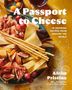 Titel: „A Passport to Cheese“. Unten rechts: „Afrim Pristine“. Auf einem Teller liegen Käse, Schinken, Obst und Grissini., Buch