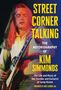 "Street Corner Talking: The Autobiography of Kim Simmonds." Ein Gitarrist spielt intensiv, umgeben von lebhaften Farben.