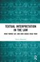 "Textual Interpretation in the Law. What Words Say, and How Judges Read Them. Nancy Diamond." Blaues Hintergrundmuster., Buch