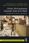 Titel: Urban Atmospheres between East and West. Miniaturstadt mit Figuren und Autos in warmen Farbtönen., Buch