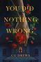 Text: "YOU DID NOTHING WRONG", "A NOVEL", "CG DREWS", "NEW YORK TIMES BESTSELLING AUTHOR".  
Hand hält tropfende rote Rose über Haus., Buch