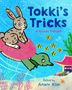 "Tokki's Tricks: A Korean Folktale. Retold by Aram Kim." Ein Hase reitet auf einer Schildkröte, umgeben von Fischen., Buch