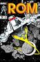 "ROM" in großen roten Buchstaben. Ein Roboter schwebt im Weltraum, umgeben von Gesichtern bekannter Comicfiguren., Buch