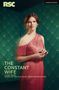 "The Constant Wife" von Laura Wade, basierend auf W. Somerset Maugham. Frau in rosa Kleid vor Art-déco-Tapete.
