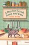 **A Day for Bread, Soup and Cats**. Eine Illustration mit einer grauen Katze auf einer Küchenzeile, umgeben von Brot, Suppe und Küchenutensilien., Buch