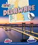 "DELAWARE" steht im Zentrum über einer Karte. Eine Brücke erstreckt sich über einen Fluss bei Sonnenuntergang., Buch