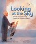 Text: "Looking at the Sky: How Dr. Janusz Korczak Fought for Children's Rights." Illustration: Mann mit Kind zum Himmel schauend., Buch