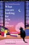Titel: "What you are looking for is in the library". Eine Katze sitzt auf einer Fensterbank, darunter Bücher, Kerze und Pflanze.