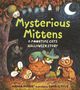 „Mysterious Mittens“ und „A Moontime Cats Halloween Story“ in gelber Schrift. Illustration von Katzen in Halloween-Kostümen., Buch