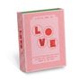 "Little Box of Love" steht auf einer rosa Schachtel mit roten Buchstaben und dekorativen Linien., Buch