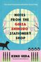 "Notes from the Ginza Shihodo Stationery Shop" steht zentral. Hintergrund: ein traditionelles Fenster mit Kirschblüten, eine schwarze Katze., Buch
