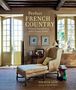 Text: "Perfect French Country: Relaxed elegance from idyllic French homes." Wohnzimmer mit Sessel, Tisch und Bücherregal.