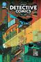 „BATMAN IN DETECTIVE COMICS VOL. 2“ auf grüner Fledermausform. Batman steht auf einem Turm, hinter ihm flatternde Fledermäuse., Buch