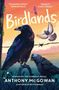 "Birdlands" groß, zwei schwarze Vögel auf Stacheldraht, ein weiterer Vogel fliegt. Sonnenuntergangshimmel., Buch