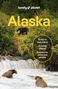 Schriftzug "lonely planet", "Alaska", Bären fischen im Wasserfall umgeben von üppiger Vegetation., Buch
