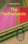 Oben: "lonely planet The Netherlands." Unten: Ein gelber Zug neben bunten Tulpenfeldern., Buch