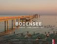 BODENSEE. Drei Länder – eine Landschaft. Ein Steg ragt in ruhiges Wasser, umgeben von vielen Wasservögeln., Buch