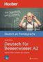 Titel: "Deutsch für Besserwisser A2". Ein lächelndes Kind vor einer Tafel mit Brille und Hosenträgern., Buch