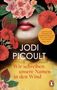 „Jodi Picoult. Roman. Wir schreiben unsere Namen in den Wind.“ Lippen und rote Blumen mit grünen Blättern., Buch