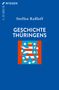 Text: "GESCHICHTE THÜRINGENS". Blaues Cover mit einem stilisierten Wappen mit Löwe und Sternen in der Mitte., Buch