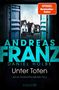 Titel: "Unter Toten" von Andreas Franz und Daniel Holbe. Ein offenes Garagentor zeigt Häuser in einer ruhigen Straße.
, Buch
