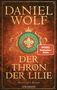 "Daniel Wolf. Der Thron der Lilie. Historischer Roman. Spiegel Bestseller-Autor." Verzierte Krone und Lilie im Hintergrund., Buch