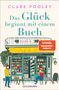 „Das Glück beginnt mit einem Buch“ von Clare Pooley. Buchladenfront mit Personen, Hund und Pflanzen., Buch