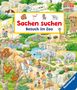 „Sachen suchen. Besuch im Zoo.“ Illustration mit Tieren wie Elefanten, Giraffen und Flamingos sowie Menschen im Zoo.