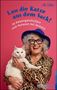 Buchtitel: "Lass die Katze aus dem Sack!" Eine Frau mit weißer Katze, Hut und Brille lächelt., Buch