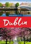 Der Text "Baedeker Smart Dublin". Eine Brücke über einen Fluss, bunte Gebäude, blühende Kirschbäume in einem Park., Buch