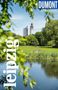Text: "leipzig" vertikal, "DUMONT Reise-Taschenbuch". Stadtpark mit Menschen, Teich, grünen Bäumen, Turm und Hochhaus im Hintergrund., Buch