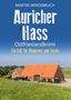 Text: "Auricher Hass - Ostfrieslandkrimi. Ein Fall für Brookmer und Jacobs." Ein Bauernhof im Grünen., Buch