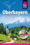 „Oberbayern. München, Chiemgau, Berchtesgadener Land.“ Vor Alpenlandschaft mit Kapelle und Logo oben rechts., Buch