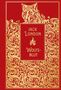Jack London, Wolfsblut. Illustration: Goldener Wolfskopf und Muster auf rotem Hintergrund., Buch