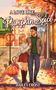"A Love Like Pumpkin Spice" von Hailey Frost. Paar unter Herbstlaub. Links Kürbis mit Katze. Warmes Kleinstadtflair., Buch