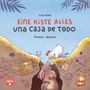 Text: "Eine Kiste Alles, Una Caja de Todo, Deutsch - Spanisch". Illustration: Hase mit Schaufel und Huhn, Schatztruhe im Boden., Buch