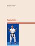 Text: "Achim Keller" und "Sanchin". Ein Mann in Karate-Kleidung in Kampfstellung vor blauem Hintergrund., Buch