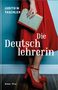 "Judith W. Taschler: Die Deutschlehrerin. Roman Picus." Eine Frau in rotem Kleid hält ein Buch vor blauem Hintergrund., Buch